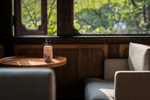a table with a candle on it in a train at The One Nanyuan in Xinpu