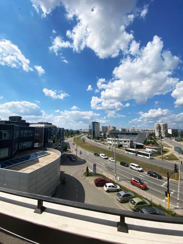a view of a city with cars on a highway at Апартамент на няколко минути от Летището in Sofia