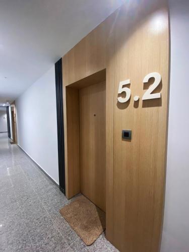 a elevator door with the number on it at Апартамент на няколко минути от Летището in Sofia