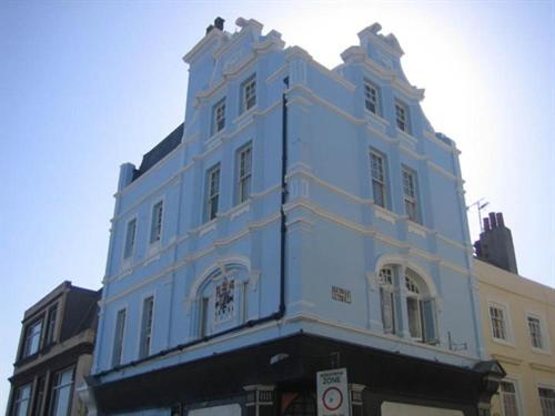 a large white building on the side of a street at The Old Town Bed and Breakfast in Hastings