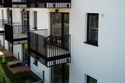 an external view of a building with balconies at Essence Apartments Topaz in Poznań