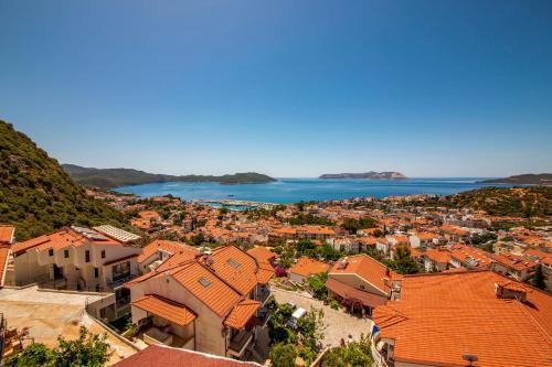 an aerial view of a town with orange roofs at Granda Lambuka Apart in Kas