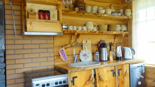 a kitchen with a sink and a stove at Juula Holiday Home in Juula