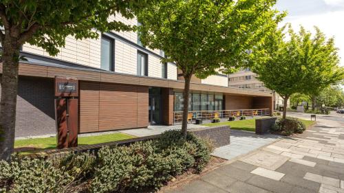 a building with trees in front of it at Staybridge Suites Newcastle by IHG in Newcastle upon Tyne