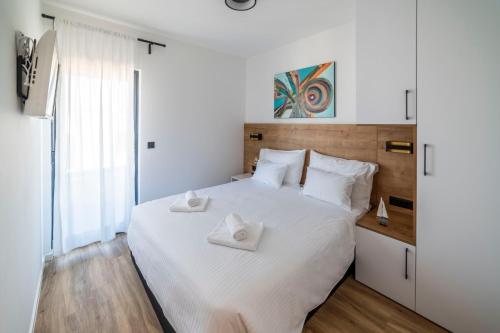 Postel nebo postele na pokoji v ubytování PINNA RESIDENCE - SV. JEROLIM