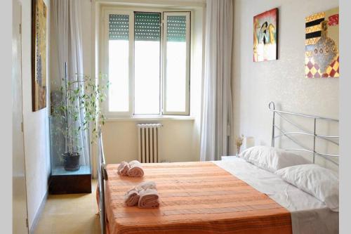 Postel nebo postele na pokoji v ubytování Mare di Roma