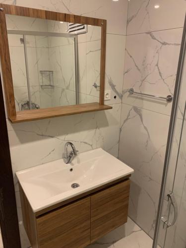 a bathroom with a sink and a shower at Royal Residence Bursa in Bursa