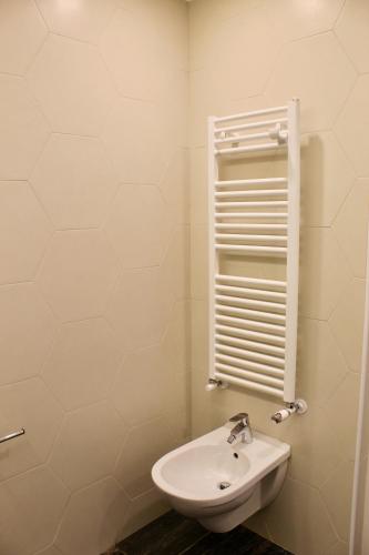 a bathroom with a toilet and a sink at Cetara Costa d'Amalfi Residence in Cetara