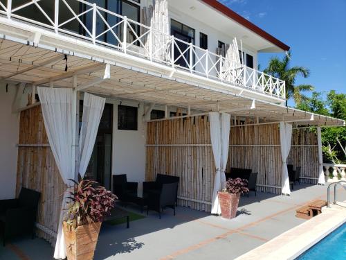 a view of the house from the pool at Pura Vista Hotel in Ocotal