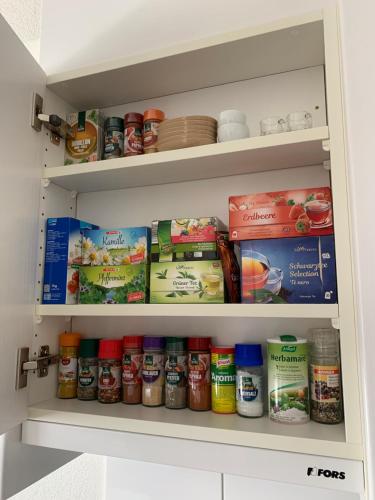 a pantry filled with lots of different food items at Holiday apartment Bolgen - close to everything! Bolgen, Jakobshorn, bus stop, train station, supermarket, ski school, ski rentals, restaurants and more! in Davos