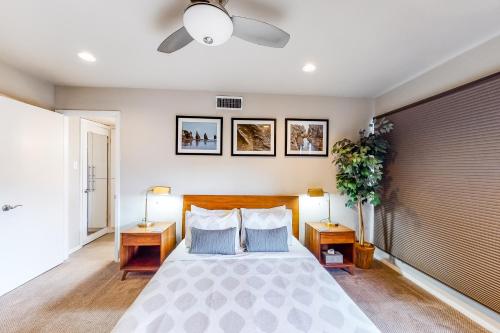 a bedroom with a large bed with two lamps at Encinal Condominiums in Austin