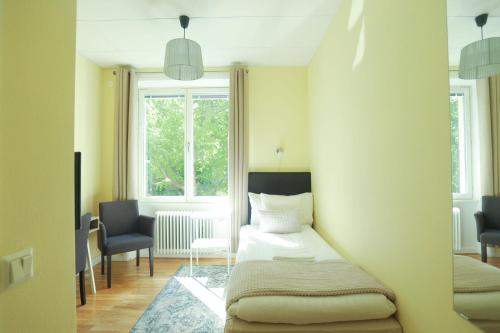 a bedroom with a bed and a window at Park Hotell in Kristinehamn