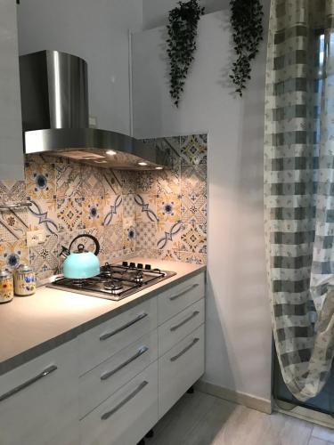 Kuchyňa alebo kuchynka v ubytovaní Marzia Etna apartment