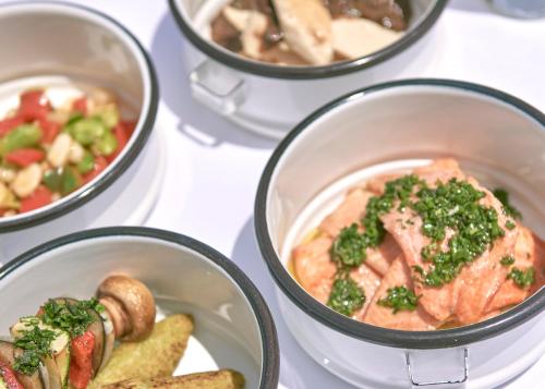 a group of bowls of food on a table at Titilaka by Andean in Tililaca