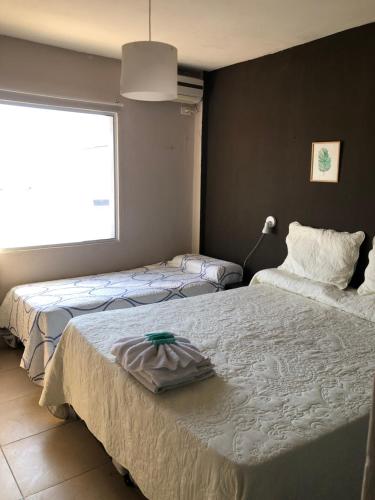 Ліжко або ліжка в номері CASTELLNOVO HOTEL