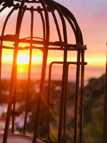 a view of the sunset from a bird cage at Unique TV & magazine featured house Mojácar Pueblo in Mojácar