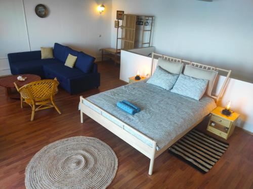 a living room with a bed and a couch at Sea House Bassi in Kraljevica