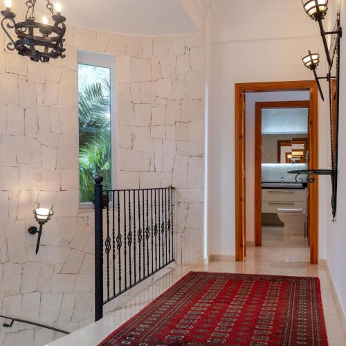 a hallway with a door leading to a bathroom at Villa Palm Kaş in Kaş