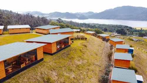 an aerial view of a house on a hill at Refugio del Neusa in Cogua