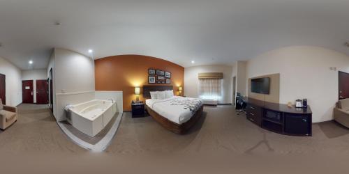 Ένα ή περισσότερα κρεβάτια σε δωμάτιο στο Restwell Inn & Suites I-45 North