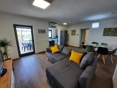 a living room with a couch and a table at Hiša Špuntar in Bovec