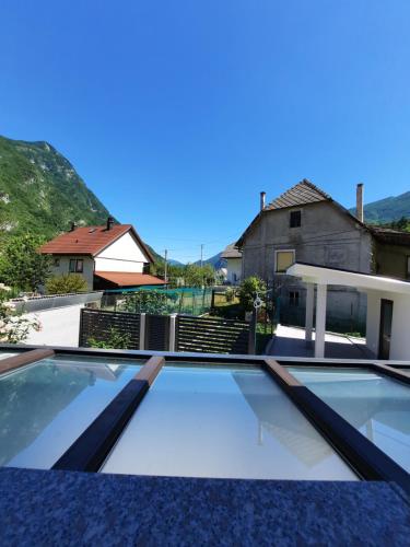 a swimming pool in front of a house at Hiša Špuntar in Bovec