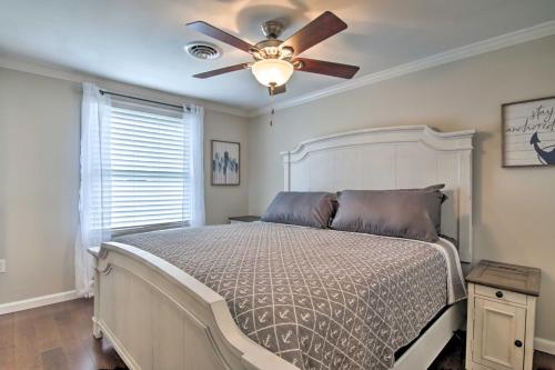 a bedroom with a bed with a ceiling fan at Pet-Friendly Ocean City Home Half Mile to Beach! in Ocean City