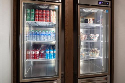 an open refrigerator with drinks and soda in it at Staybridge Suites - Carson City - Tahoe Area by IHG in Carson City