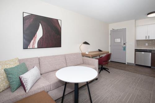 a living room with a couch and a table at Staybridge Suites - Carson City - Tahoe Area by IHG in Carson City