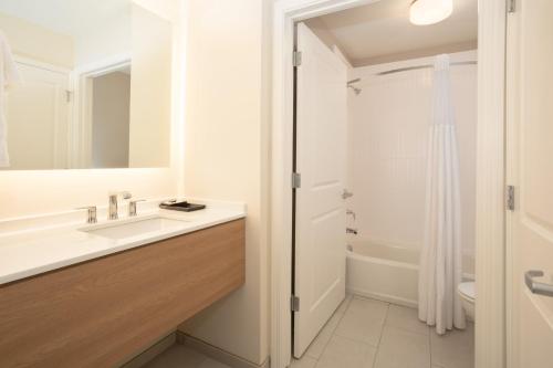 a bathroom with a sink and a shower at Staybridge Suites - Carson City - Tahoe Area by IHG in Carson City