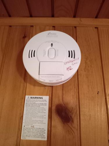 a white router sitting on top of a wooden table at MERIKOTKA - a cozy wooden cottage, sLOVEnia in Braslovče