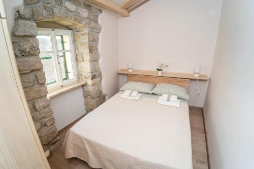 Postel nebo postele na pokoji v ubytování Apartman Nono Tone