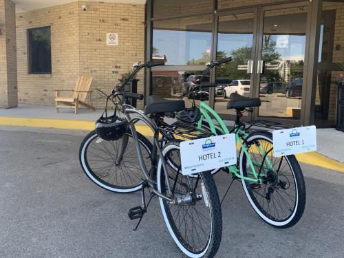 two bikes parked next to each other on a street at Days Inn by Wyndham Sarnia Harbourfront in Sarnia