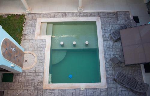 an overhead view of a swimming pool in a building at Hotel Las Monjas in Mérida