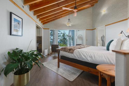 a bedroom with a large bed and a table at Ocean House in Newport