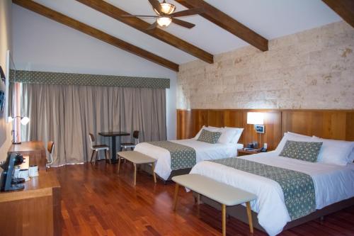 Postel nebo postele na pokoji v ubytování Los Brezos Hotel Boutique