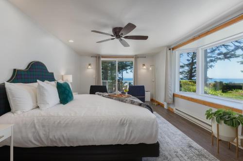a bedroom with a bed and a large window at Ocean House in Newport