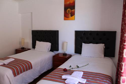 Postel nebo postele na pokoji v ubytování KAARO HOUSE CUSCO