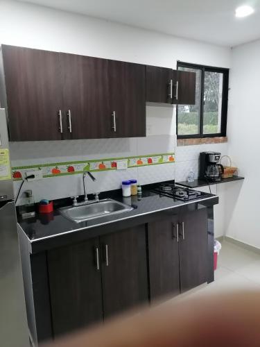 Kuchyň nebo kuchyňský kout v ubytování Apartamento Campestre Pereira