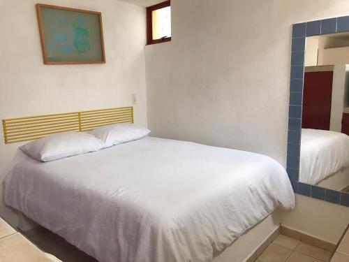Katil atau katil-katil dalam bilik di INMOTEGA - Suites TG