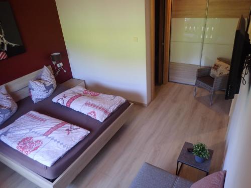 Una cama o camas en una habitación de Hotel Sonnenlicht Maria Alm