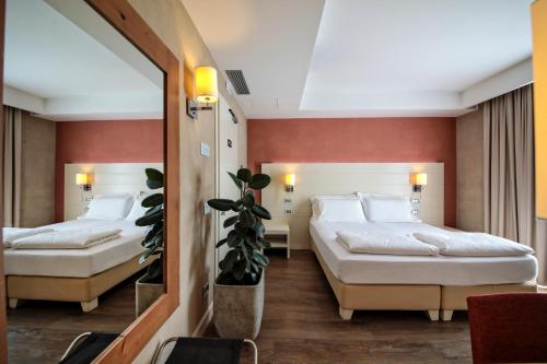 A bed or beds in a room at H2O ROOMS