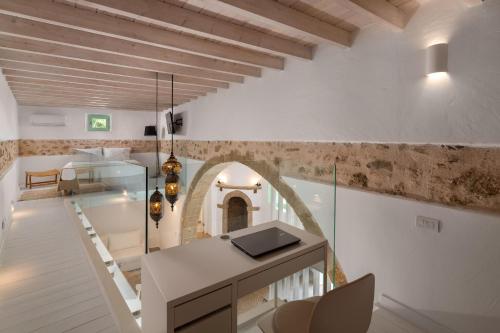 a home office with a desk and a staircase at Dipagio Origin Villa in Lachania