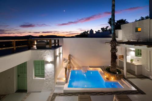 a swimming pool on the roof of a house at Dipagio Origin Villa in Lachania