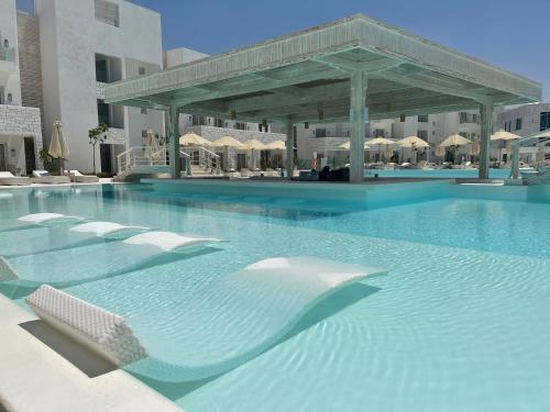 a large swimming pool with a large swimming pool at Tanoak Resort in Ain Sokhna