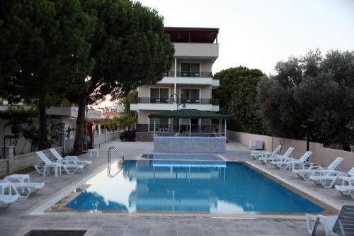 a swimming pool in front of a building at Keyf Konak Boutique Hotel in Aydın