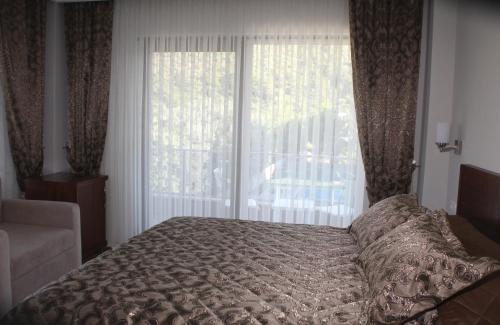 Ένα ή περισσότερα κρεβάτια σε δωμάτιο στο Keyf Konak Boutique Hotel