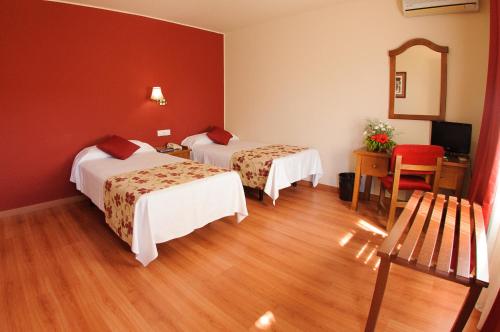 Postel nebo postele na pokoji v ubytování Hotel Dunas Puerto