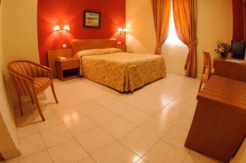 Postel nebo postele na pokoji v ubytování Hotel Dunas Puerto