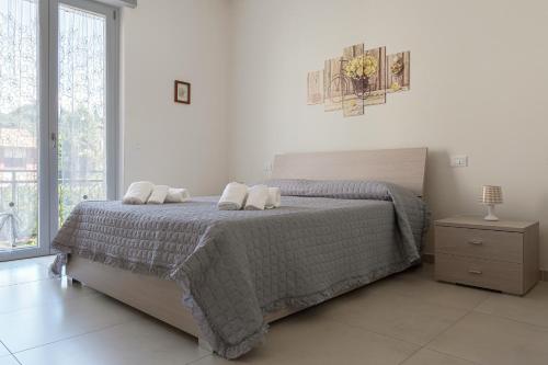 A bed or beds in a room at Casa Vacanza MariaTeresa